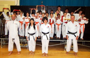  (Please Click to Enlarge) Wednesday 2nd July 2014. Examiners Sensei Martin Dobson (4th Dan) & Sensei Tony Cronk (3rd Dan) with Sensei Shahinaz Pelter, Patrick Pelter & some of Bromley & South East London JKA Karate Club students after the club's very succsseful grading with a 100% pass rate ! Many thanks to Sensei Martin & Sensei Tony. Congratulations to Everyone!