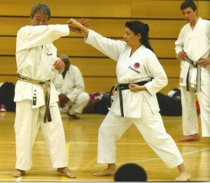 (Click to Enlarge) Sensei Shahinaz Pelter demonstrating with Sensei Omura 7th Dan some kata applications during the JKA England International Course.
