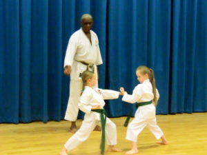 (Click to Enlarge) Sensei Roy Tomlin (MBE) ( 7th Dan), with Jessica & Madison demonstrating a brilliant kumite exercise. 