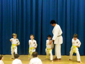 (Click to Enlarge) Sensei Adel checking our Yellow belt attack techniques. Yes, they were very powerful!!