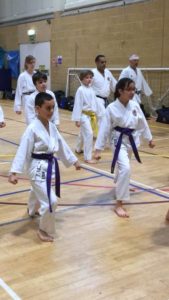 (Click to Enlarge) Wasiq, Kasim & Sophia practicing Mae Geri during the JKAE Course, 6th January 2018, Guilford.