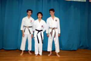 (Click to Enlarge) Xin with his Black Belt surrounded by Sensei Patrick & William. Great Achievement & Great Frienship! Well Done Xin!!!