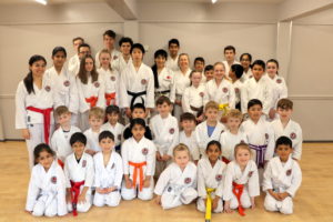 (Click to Enlarge) Bromley & South East London members congratulating Xin for his obtaining his well deserved Black Belt!!! 